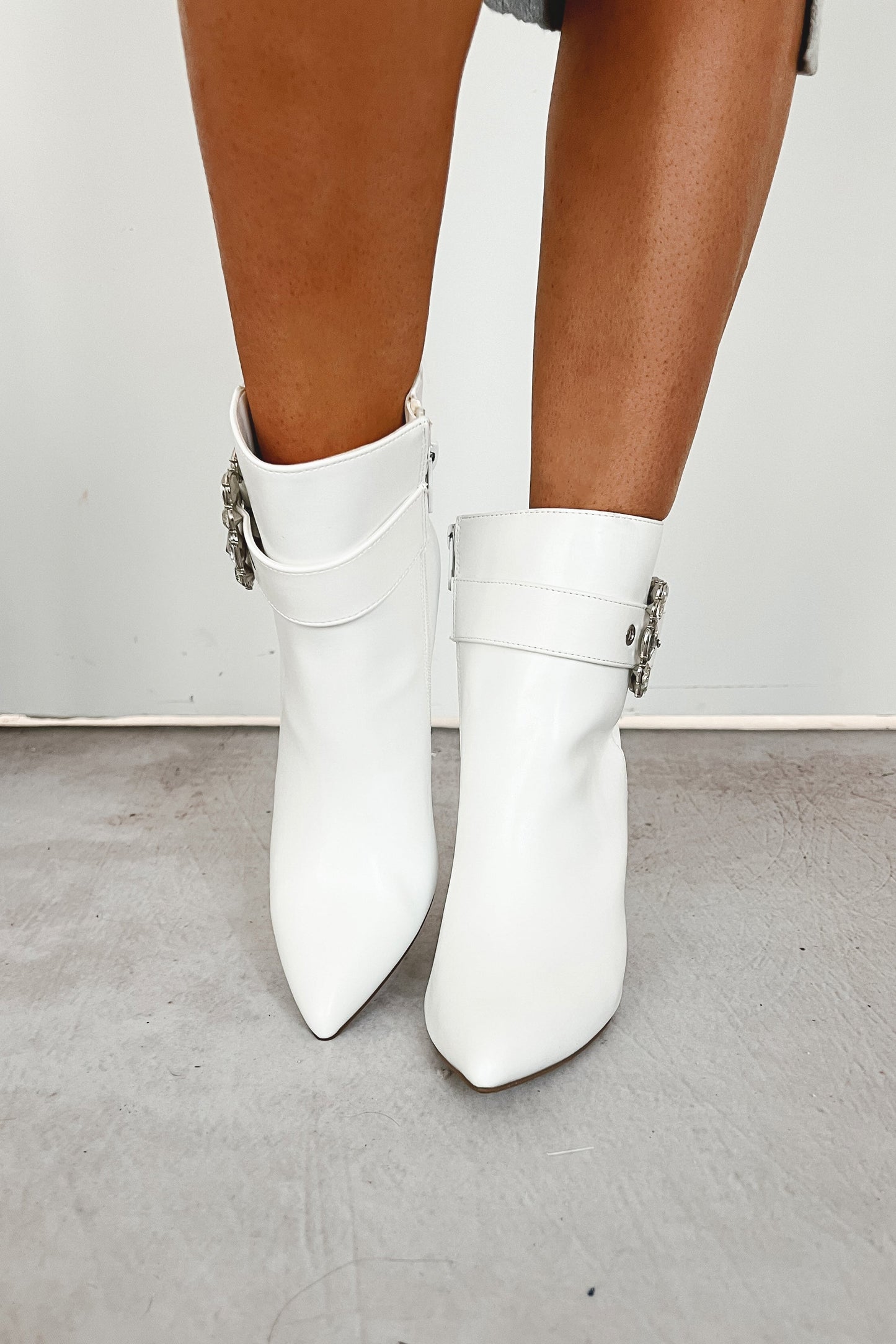 Dion Rhinestone Buckle Pointed Toe Booties (White Pu)