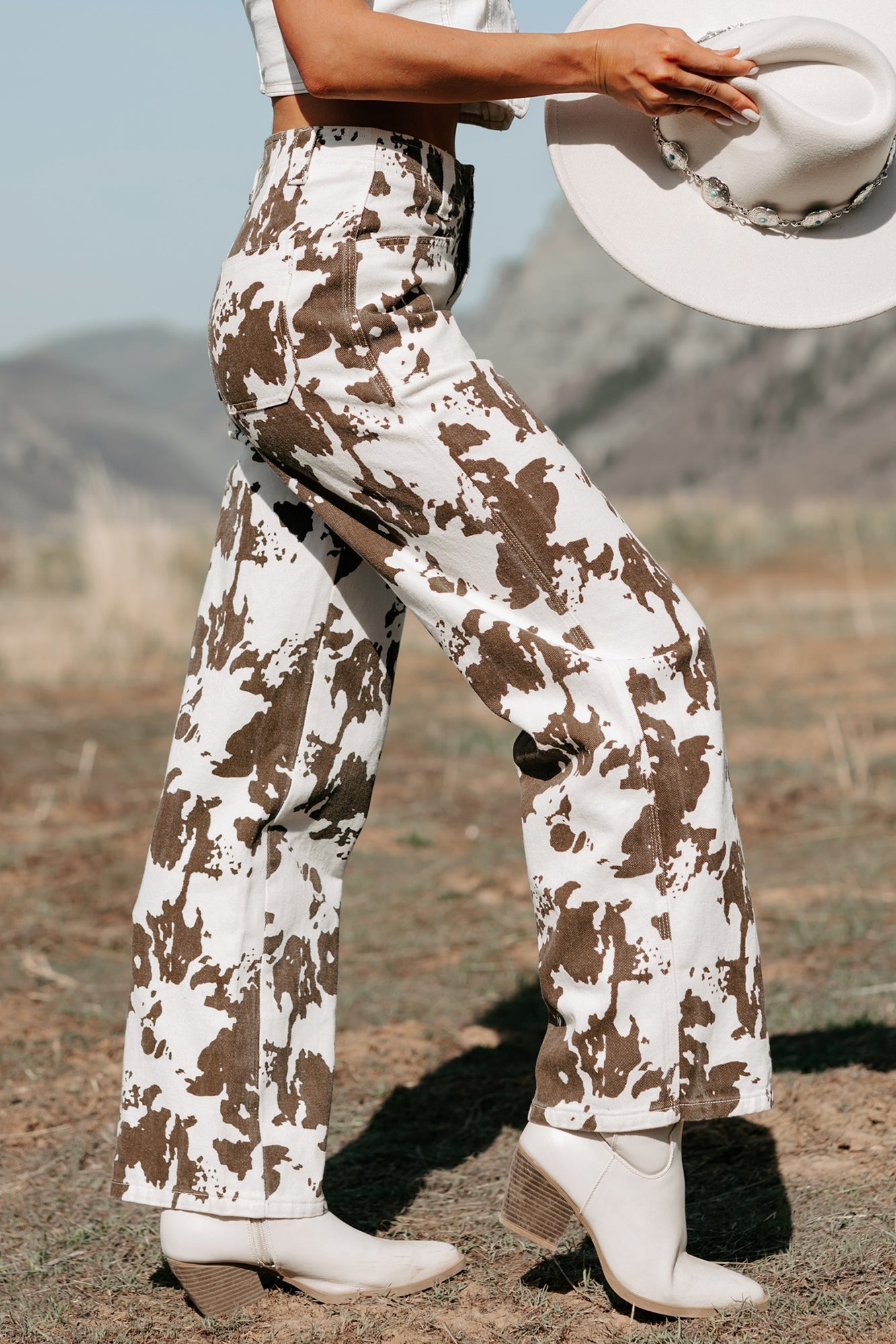 Cowboy Up Cow Print Pants (White/Brown)